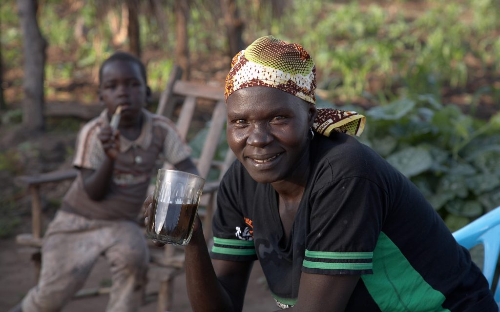Female farm worker drinking coffee