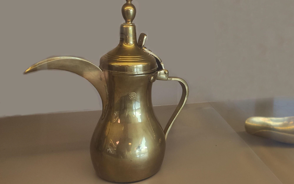 a bronze dallah used to brew qahwa